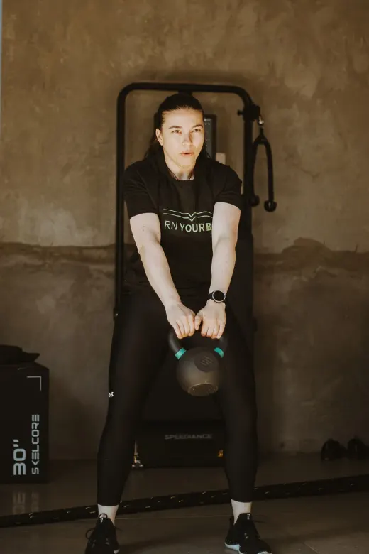 Online personal training client running a treadmill cardio session at home